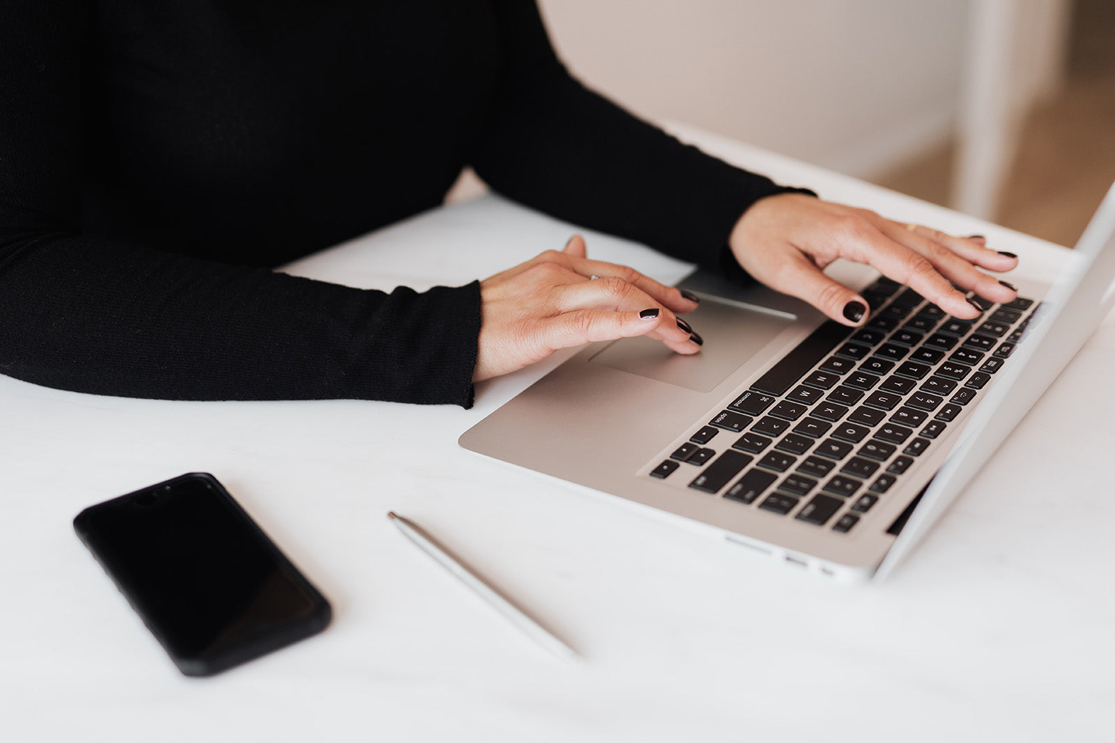 Female entrepreneur building a successful sales funnel using a Kajabi sales funnel bundle by Just Add Your Brand™.