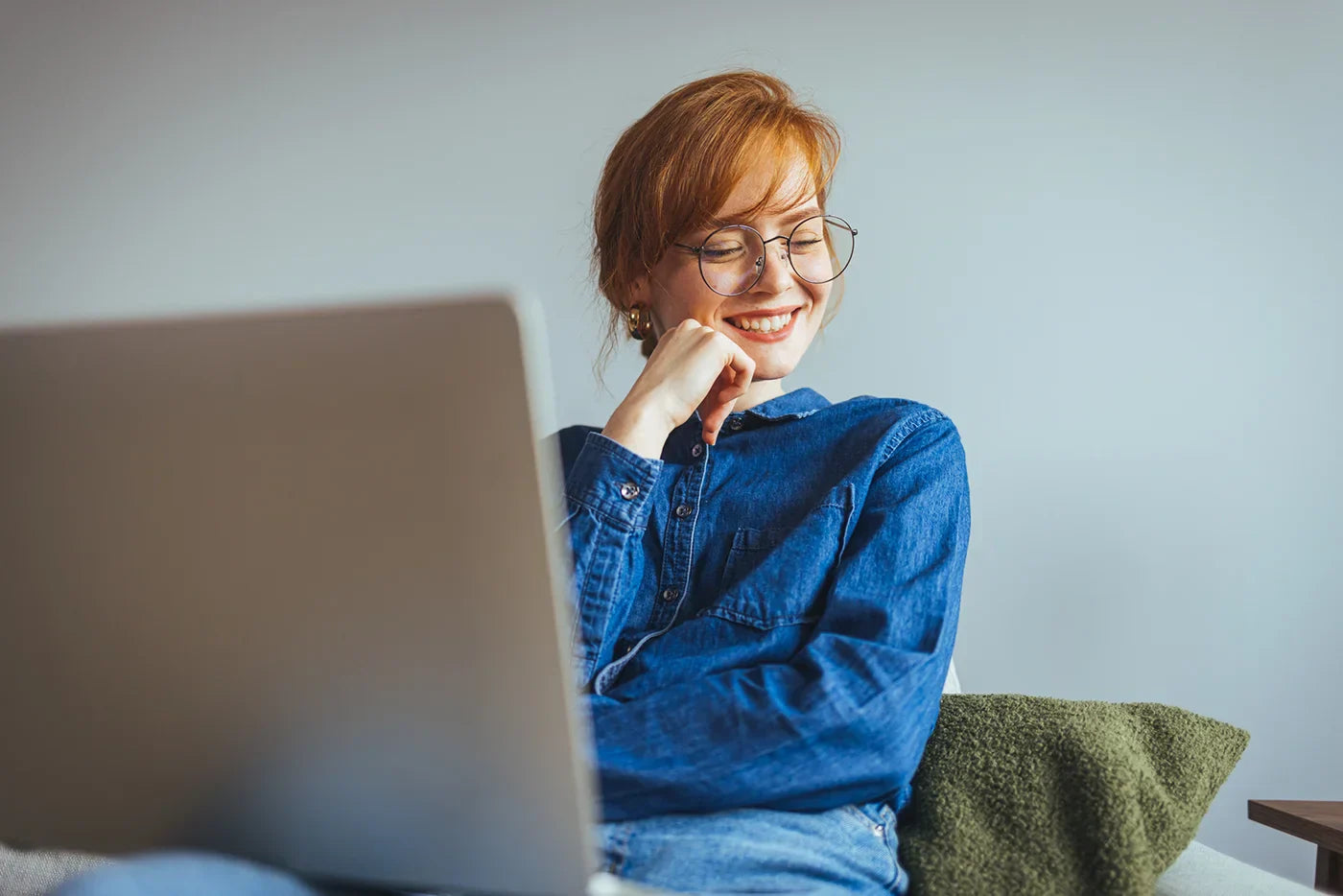 female entrepreneur contemplating how to sell digital products