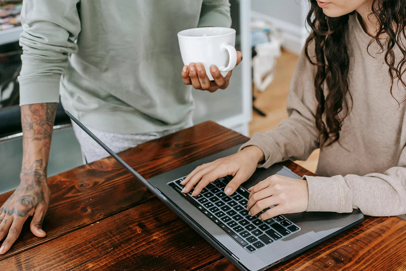 Man and woman researching and comparing Kajabi vs Circle, to decide which is better for hosting their online course and community.